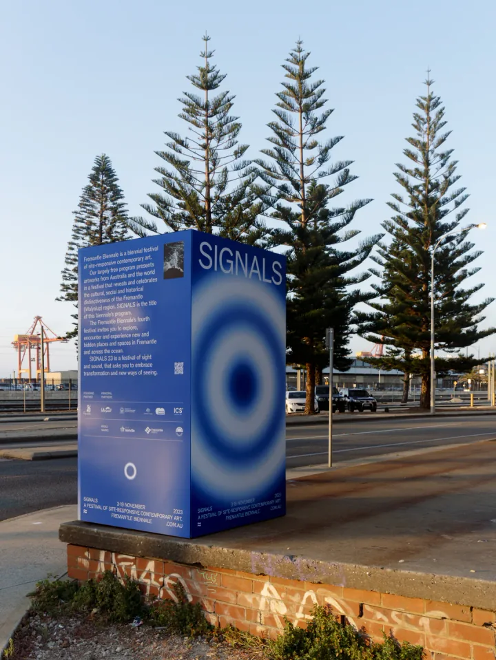 The blue Signals wayfinding monolith beside Fremantle harbour