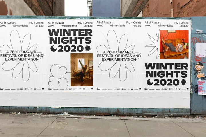 Winter Nights campaign posters on a street hoarding