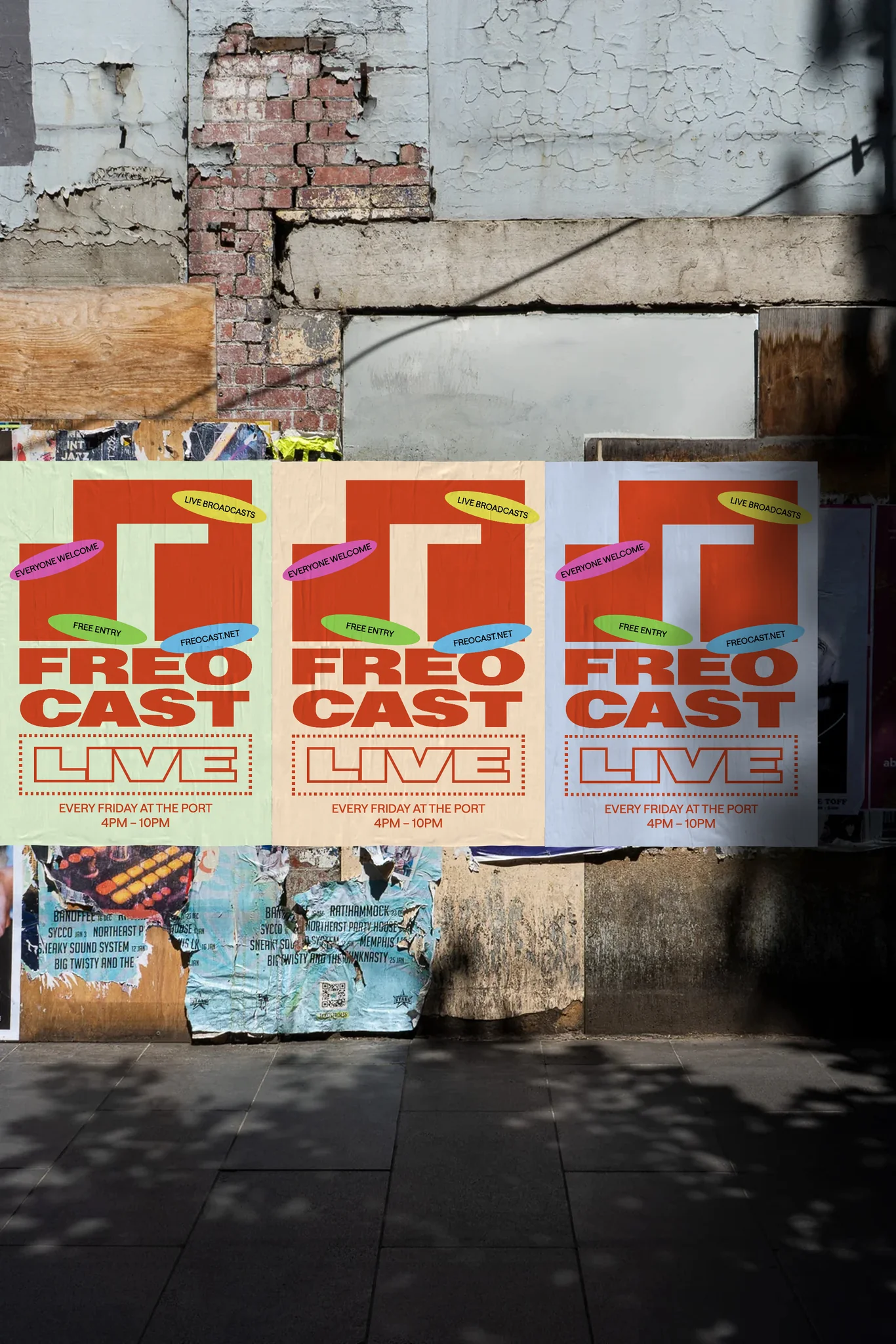 FREOCAST Live poster mockup on a weathered street wall, with orange lettering on green, yellow and blue backgrounds