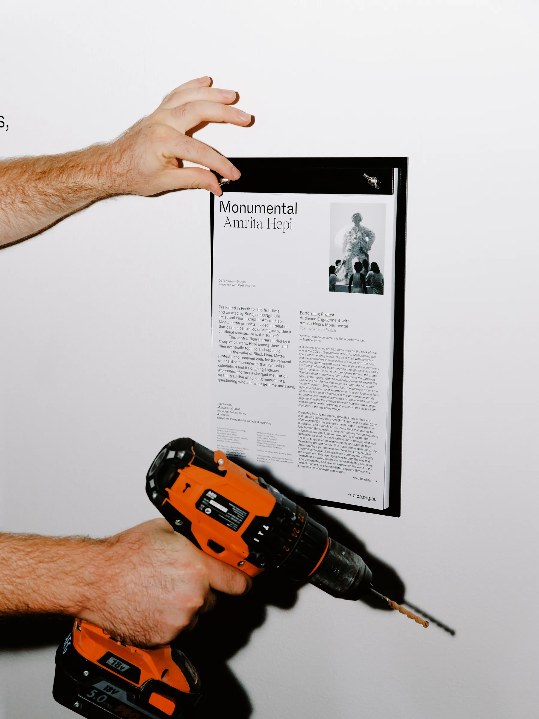 Exhibition information and identity being installed inside the PICA galleries