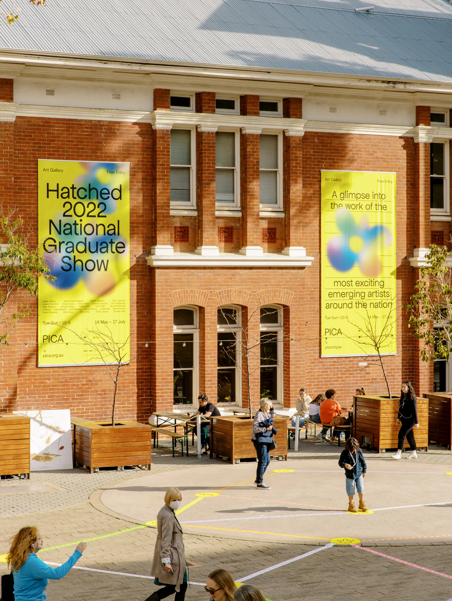 Yellow Hatched campaign banners on the PICA gallery building