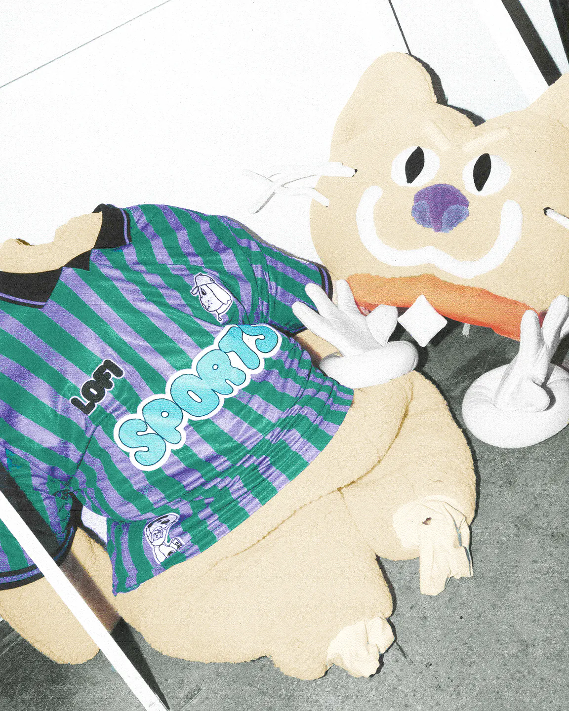 Yellow mascot artwork wearing the striped Sports Dreams and Lo-Fi jersey