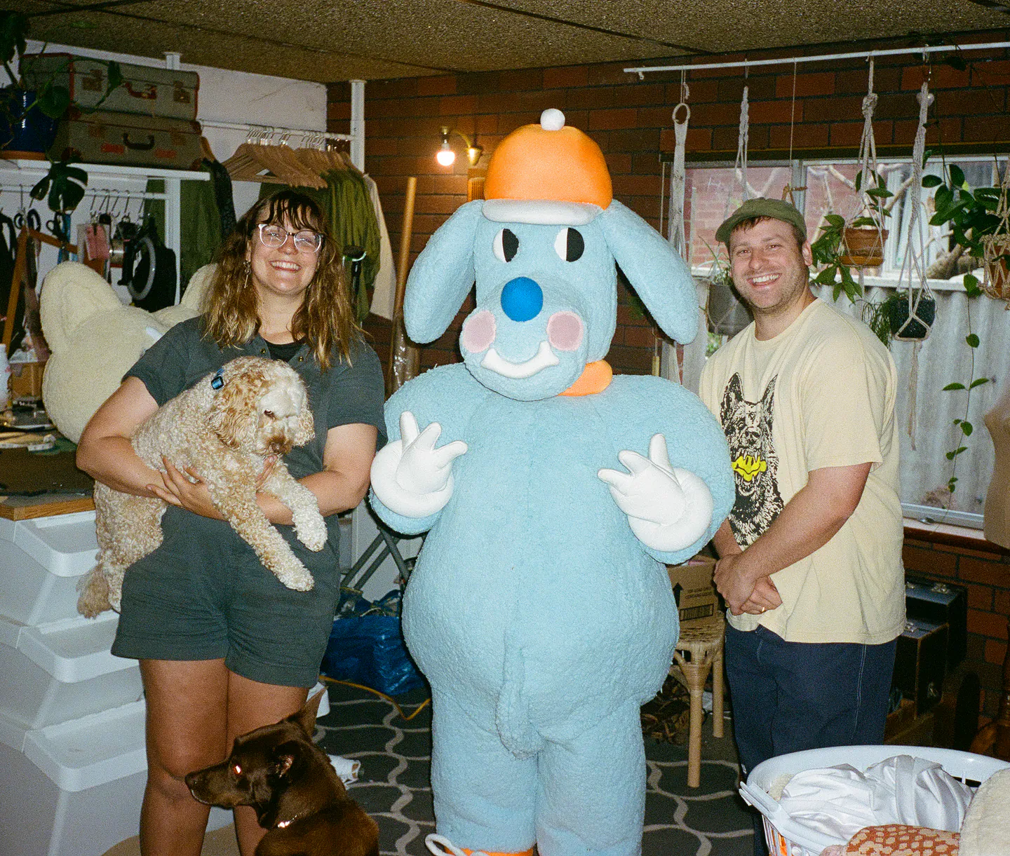The Sports Dreams team with the full-size blue mascot in the studio